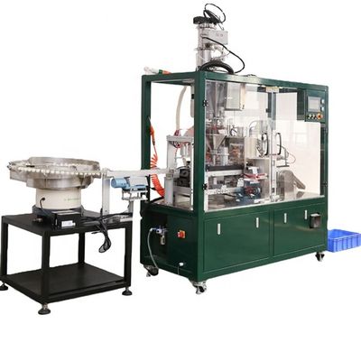 Machine de remplissage de capsules de café à bras de sortie pour un remplissage constant et précis
